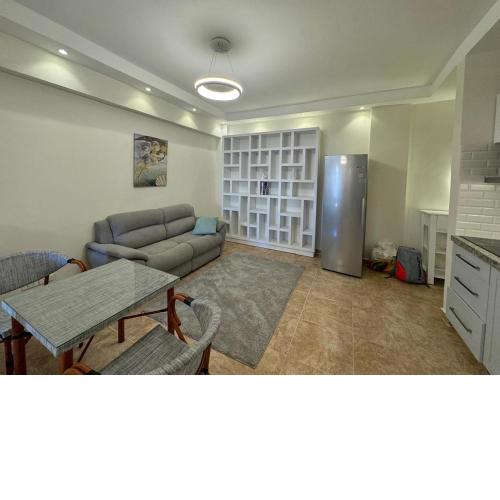 A one-bedroom apartment with a compact terrace