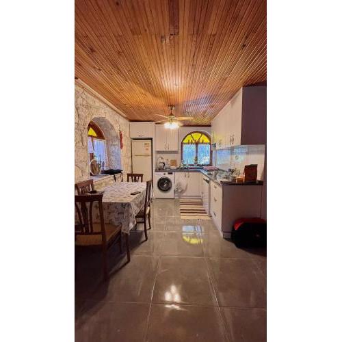 Detached stone house with access to a large garden near beach