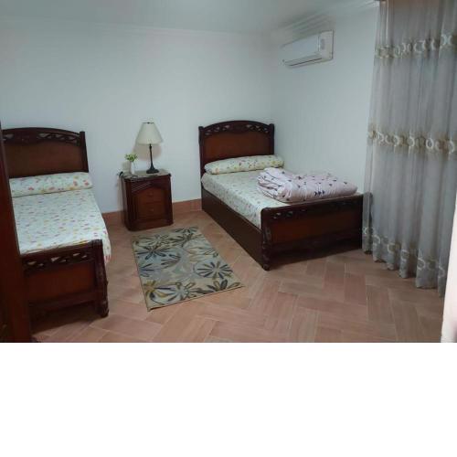 Ground floor villa with private garden, parking and shared swimming pool