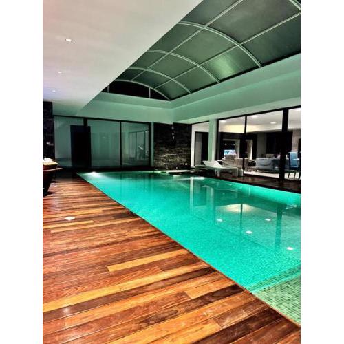 Luxury villa with a heated indoor pool and direct access to the beach