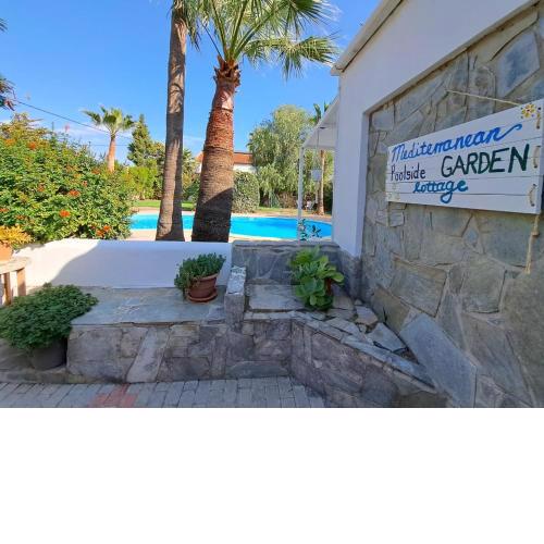 Mediterranean poolside garden cottage
