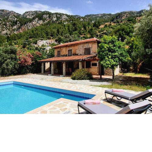 Stone house in Faralya