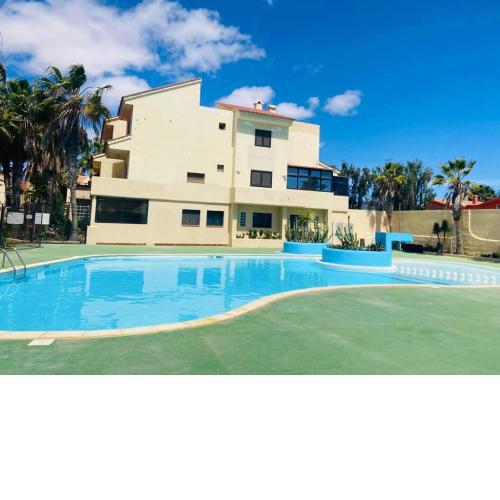 Surf & Chill Bungalow 69, quiet green oasis with community swimmingpool