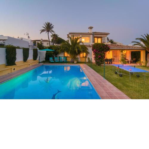 Typical beach house Las Chapas Playa with heated pool